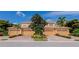 Attractive townhomes featuring well-maintained lawns, brick driveways, and attached garages in a vibrant community at 318 Winding Brook Ln # 104, Bradenton, FL 34212