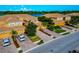 Beautifully landscaped townhomes with well-manicured lawns, brick driveways, and attached garages in a serene setting at 318 Winding Brook Ln # 104, Bradenton, FL 34212