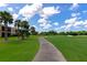 Scenic view of the golf course and lush landscaping, perfect for leisurely walks and enjoying the outdoors at 318 Winding Brook Ln # 104, Bradenton, FL 34212
