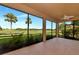 Enjoy the relaxing lanai with its screened enclosure, ceiling fan, and gorgeous views of the lush golf course at 318 Winding Brook Ln # 104, Bradenton, FL 34212