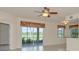 Bright living room featuring sliding glass doors to a patio and tile flooring at 318 Winding Brook Ln # 104, Bradenton, FL 34212
