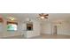 Open-concept living space with lots of natural light, tile floors, and a ceiling fan at 318 Winding Brook Ln # 104, Bradenton, FL 34212