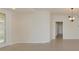Open living room with decorative glass door, tile flooring, and recessed lighting at 318 Winding Brook Ln # 104, Bradenton, FL 34212