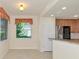 Bright living room with open concept; flows into kitchen/dining area; window with view at 318 Winding Brook Ln # 104, Bradenton, FL 34212