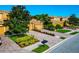 Charming townhomes featuring paved driveways, mature trees, and manicured landscaping in a well-maintained community at 318 Winding Brook Ln # 104, Bradenton, FL 34212