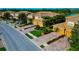 Scenic street view of well-maintained townhomes, featuring lush landscaping and manicured lawns at 318 Winding Brook Ln # 104, Bradenton, FL 34212