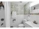 Bathroom featuring tropical wallpaper, a shower with curtain, and updated fixtures at 327 Francis Dr, Apollo Beach, FL 33572