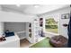 bedroom featuring a loft bed, desk, turf rug, and ample natural light at 327 Francis Dr, Apollo Beach, FL 33572
