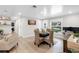 Bright dining room with a round wooden table, stylish wicker chairs, and natural light from the window at 327 Francis Dr, Apollo Beach, FL 33572