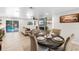 Open-concept living and dining area with an adjacent kitchen and outdoor view for entertaining and relaxing at 327 Francis Dr, Apollo Beach, FL 33572