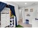 Hallway with built-in shelving, storage and sporty decorative elements at 327 Francis Dr, Apollo Beach, FL 33572