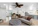 Spacious living area with a neutral color scheme, featuring a view into the dining room and kitchen at 327 Francis Dr, Apollo Beach, FL 33572