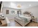 Bright main bedroom with a king-size bed, light-colored furniture, and modern decor at 327 Francis Dr, Apollo Beach, FL 33572