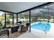 Relaxing screened-in pool area with seating, perfect for enjoying sunny days at 327 Francis Dr, Apollo Beach, FL 33572