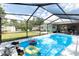 Inviting screened-in pool with floaties, perfect for outdoor entertaining and relaxation at 327 Francis Dr, Apollo Beach, FL 33572