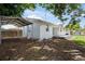 Spacious backyard with a carport, perfect for parking vehicles or storing equipment at 3310 W 9Th Ave, Bradenton, FL 34205