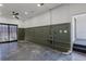 Spacious basement with exposed ceiling and a dark painted accent wall at 3310 W 9Th Ave, Bradenton, FL 34205