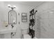 Modern bathroom featuring tiled shower and floating sink at 3310 W 9Th Ave, Bradenton, FL 34205