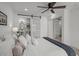 Relaxing bedroom with a ceiling fan and easy access to the bathroom at 3310 W 9Th Ave, Bradenton, FL 34205