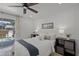 Relaxing bedroom with a ceiling fan and sliding door access to a patio at 3310 W 9Th Ave, Bradenton, FL 34205
