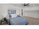 Bright bedroom featuring a ceiling fan, light hardwood floors, and modern decor at 3310 W 9Th Ave, Bradenton, FL 34205