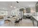 Open floor plan with modern kitchen featuring updated appliances and dining space at 3310 W 9Th Ave, Bradenton, FL 34205