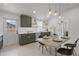 Well-lit kitchen featuring custom cabinets, white counters, and stainless steel appliances at 3310 W 9Th Ave, Bradenton, FL 34205