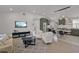 Open-concept living space with hardwood floors, neutral decor, and modern lighting at 3310 W 9Th Ave, Bradenton, FL 34205