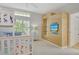 Bright bedroom features a built-in entertainment center, bunk beds, and large windows for great natural light at 340 Bermuda Ct # 5, Venice, FL 34293