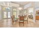 Dining area with glass table and mirrored accent wall for maximum light at 340 Bermuda Ct # 5, Venice, FL 34293