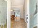 A glimpse through ornate glass doors into the foyer, dining area and screened-in pool at 340 Bermuda Ct # 5, Venice, FL 34293