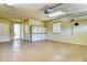Spacious garage provides ample storage space with access doors to the interior and exterior of the home at 340 Bermuda Ct # 5, Venice, FL 34293