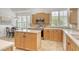 Eat-in kitchen with stainless steel appliances and natural light from windows at 340 Bermuda Ct # 5, Venice, FL 34293