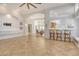 Open floor plan with tile flooring, kitchen bar, high ceilings and decorative columns at 340 Bermuda Ct # 5, Venice, FL 34293