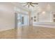 Living room with tile flooring, high ceilings, decorative niche, and view to the screened lanai and pool at 340 Bermuda Ct # 5, Venice, FL 34293