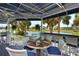 Relaxing outdoor seating area overlooking the serene lake and golf course, offering a perfect spot to unwind at 340 Bermuda Ct # 5, Venice, FL 34293
