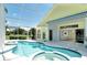 Wonderful pool with hot tub and screened enclosure with a partial view of the interior at 340 Bermuda Ct # 5, Venice, FL 34293