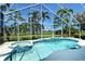 Gorgeous pool with spa and water feature overlooking the lush golf course and clear blue skies at 340 Bermuda Ct # 5, Venice, FL 34293