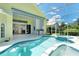 Beautiful in-ground pool and hot tub with screened in lanai and access to the home's interior at 340 Bermuda Ct # 5, Venice, FL 34293