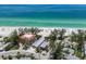 Coastal property steps from the beautiful shoreline offering stunning views and access to crystal-clear waters at 3720 Gulf Dr, Holmes Beach, FL 34217