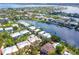 Beautiful aerial view of a luxury neighborhood with waterfront access and stunning landscaping at 3954 Hamilton Club Cir # 14, Sarasota, FL 34242