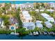 Aerial view of waterfront home near the beach with boat dock and sparkling blue water at 3954 Hamilton Club Cir # 14, Sarasota, FL 34242