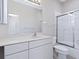 Bright bathroom with a vanity, mirror, toilet, and shower with glass doors at 3954 Hamilton Club Cir # 14, Sarasota, FL 34242