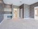 Spacious bedroom with neutral carpet, custom built-ins, and access to a bathroom; ready for personalization at 3954 Hamilton Club Cir # 14, Sarasota, FL 34242