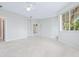 Spacious bedroom with a ceiling fan and large windows providing lots of natural light at 3954 Hamilton Club Cir # 14, Sarasota, FL 34242