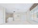 Bright and airy living room featuring large windows, plush carpeting, and an open floor plan at 3954 Hamilton Club Cir # 14, Sarasota, FL 34242