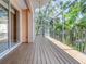 Expansive screened patio with wood flooring, offering a seamless transition between indoor and outdoor living at 3954 Hamilton Club Cir # 14, Sarasota, FL 34242