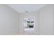 Open doorway leading into a bright room with a grand piano at 3954 Hamilton Club Cir # 14, Sarasota, FL 34242