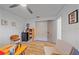 Bedroom featuring a ceiling fan, wood-look flooring, and closet at 4396 Pasadena Cir, Sarasota, FL 34233