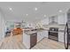 Bright, open concept kitchen with granite countertops that looks into the living room at 4396 Pasadena Cir, Sarasota, FL 34233